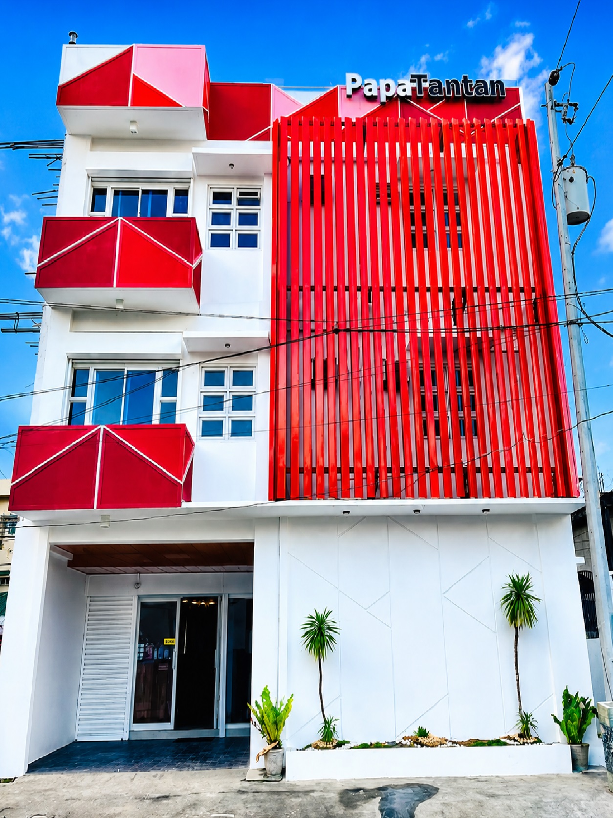 Papa Tantan Apartelle Legazpi Main branch building and signage